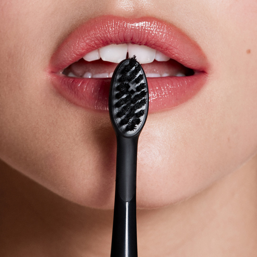 What is the difference between a sonic toothbrush and an electric toothbrush?