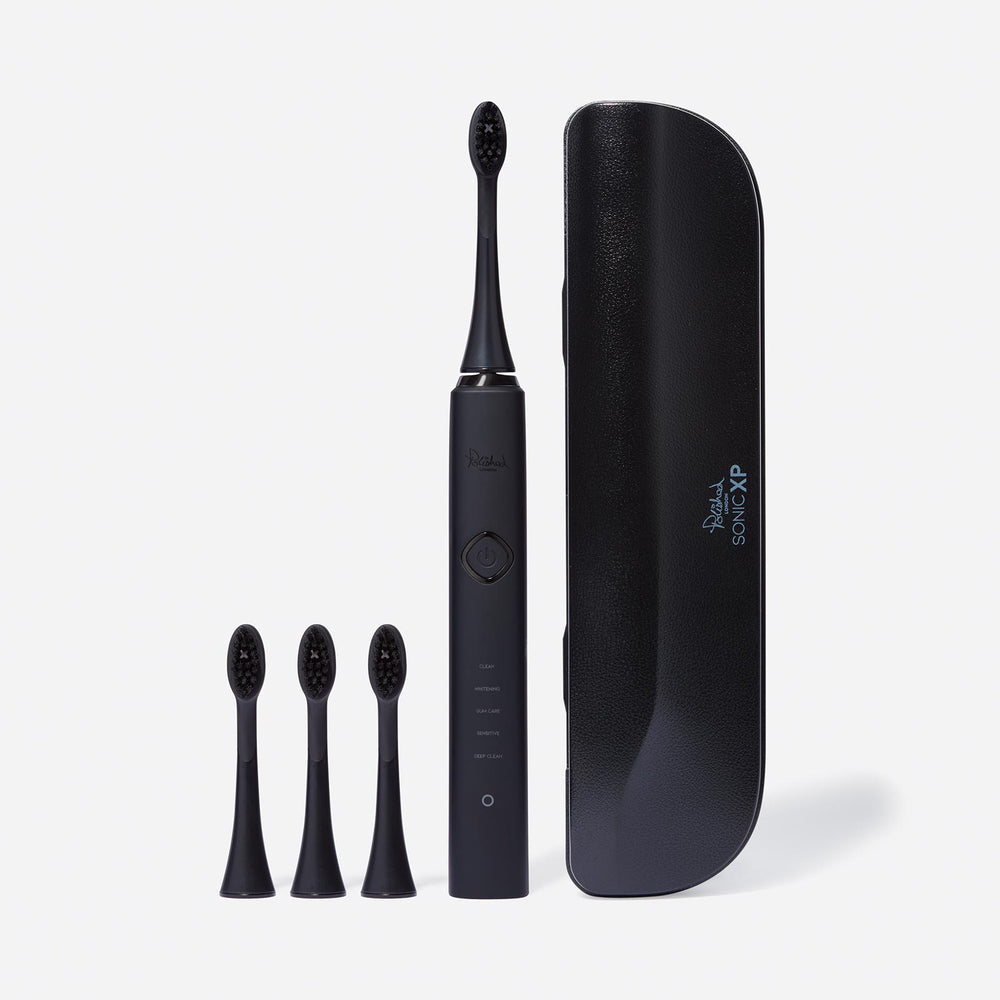 
                  
                    The Sonic Toothbrush, brush heads and travel case in black
                  
                