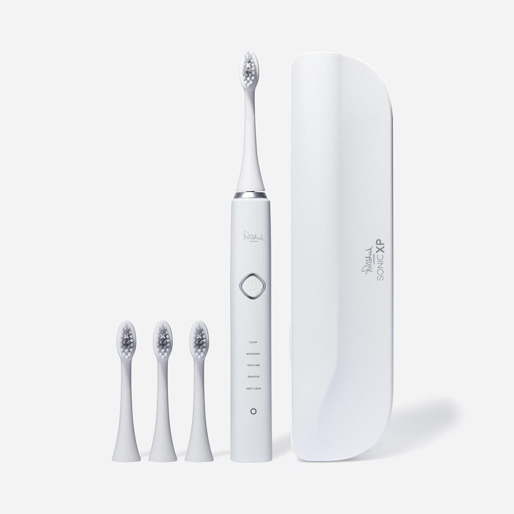 
                  
                    The Sonic Toothbrush, brush heads and travel case in white
                  
                